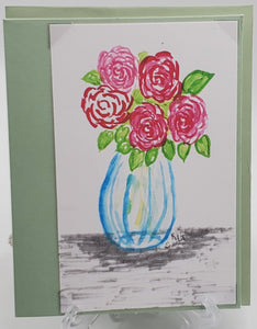 Red & Pink flowers in blue vase greeting card